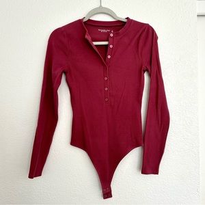 A&F Long-Sleeve Ribbed Henley Button-Down Bodysuit in Dark Pink